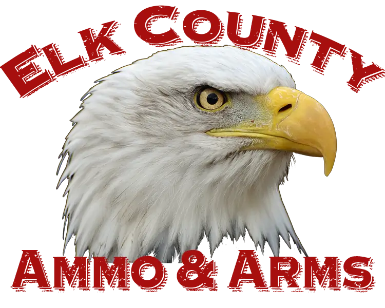 A detailed illustration of a bald eagle’s head is centered, with the words “Elk County” above and “Ammo & Arms” below in bold red text.